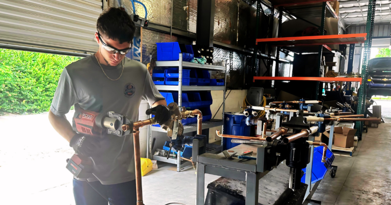Lee County Services Employee Assembling a Dual Check Valve